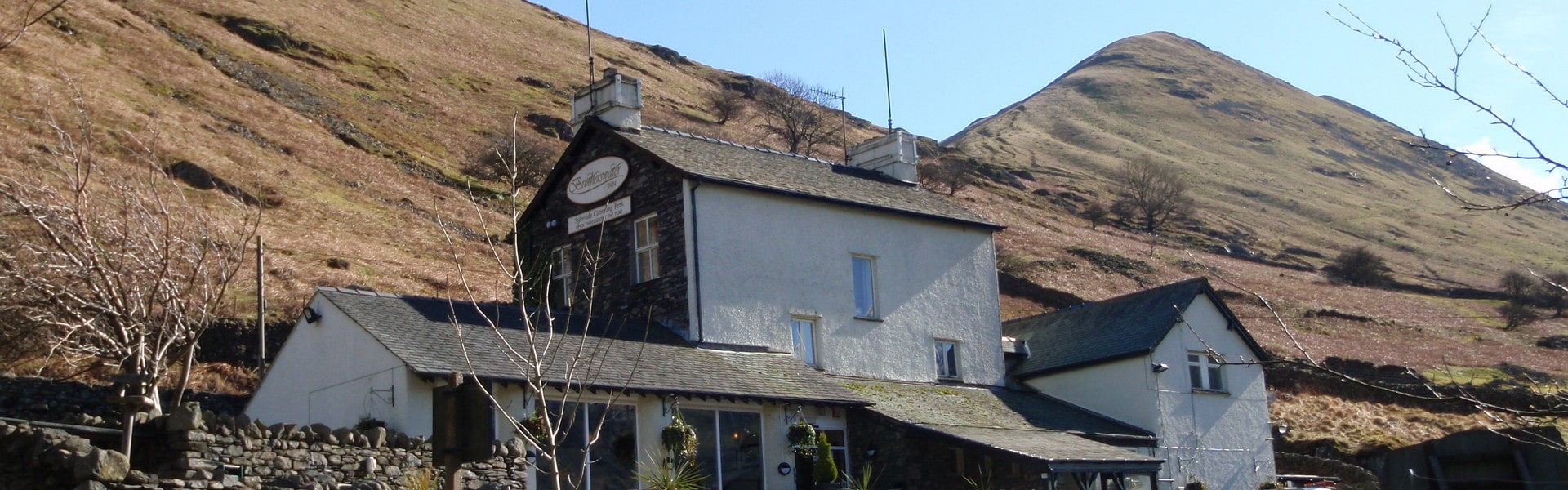 Brotherswater Inn with the Lake District Fells behind it