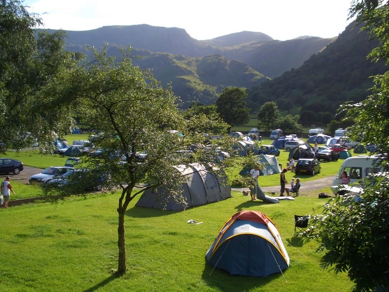 campsite-on-summer-evening 800×600-min A busy Sykeside campsite in glorious sunshine, with tents pitched and the Lake District hills in the background